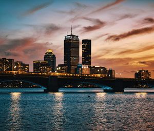 Preview wallpaper city, buildings, bridge, water, twilight, sunset