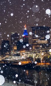 Preview wallpaper city, buildings, bridge, snow, bokeh