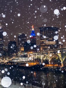 Preview wallpaper city, buildings, bridge, snow, bokeh