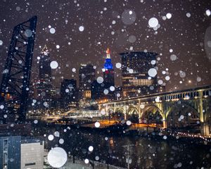 Preview wallpaper city, buildings, bridge, snow, bokeh