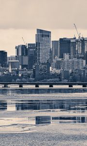 Preview wallpaper city, buildings, bridge, river, reflection, black and white