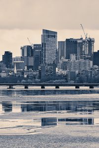 Preview wallpaper city, buildings, bridge, river, reflection, black and white