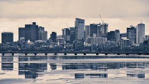 Preview wallpaper city, buildings, bridge, river, reflection, black and white