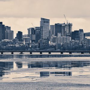 Preview wallpaper city, buildings, bridge, river, reflection, black and white