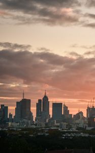 Preview wallpaper city, buildings, clouds, sunset