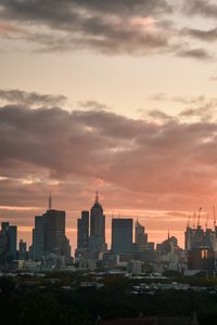 Preview wallpaper city, buildings, clouds, sunset