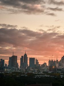 Preview wallpaper city, buildings, clouds, sunset
