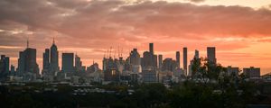 Preview wallpaper city, buildings, clouds, sunset