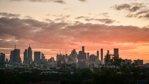 Preview wallpaper city, buildings, clouds, sunset