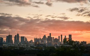 Preview wallpaper city, buildings, clouds, sunset