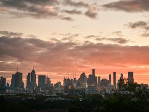 Preview wallpaper city, buildings, clouds, sunset