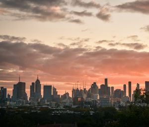 Preview wallpaper city, buildings, clouds, sunset