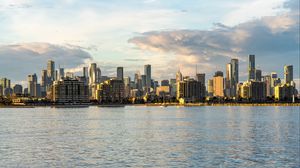 Preview wallpaper city, buildings, clouds, river, water