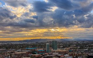 Preview wallpaper city, buildings, clouds, cityscape, aerial view