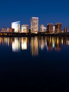 Preview wallpaper city, buildings, coast, water, reflection