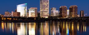 Preview wallpaper city, buildings, coast, water, reflection