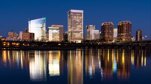 Preview wallpaper city, buildings, coast, water, reflection