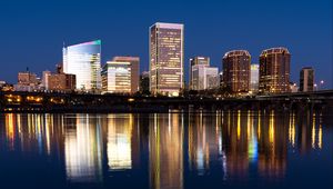 Preview wallpaper city, buildings, coast, water, reflection