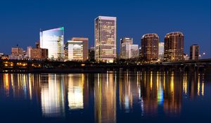 Preview wallpaper city, buildings, coast, water, reflection