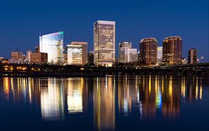 Preview wallpaper city, buildings, coast, water, reflection