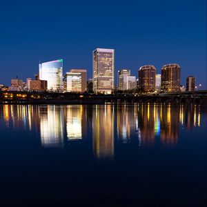 Preview wallpaper city, buildings, coast, water, reflection