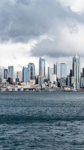 Preview wallpaper city, buildings, coast, water, waves