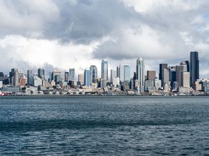 Preview wallpaper city, buildings, coast, water, waves