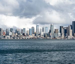 Preview wallpaper city, buildings, coast, water, waves