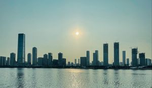 Preview wallpaper city, buildings, embankment, water, twilight