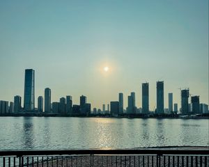 Preview wallpaper city, buildings, embankment, water, twilight