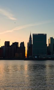 Preview wallpaper city, buildings, evening, water