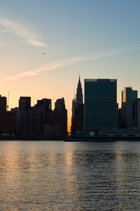 Preview wallpaper city, buildings, evening, water