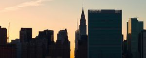 Preview wallpaper city, buildings, evening, water