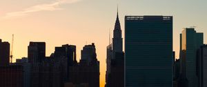 Preview wallpaper city, buildings, evening, water
