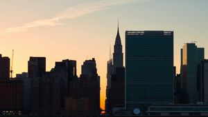 Preview wallpaper city, buildings, evening, water