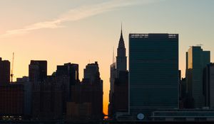 Preview wallpaper city, buildings, evening, water