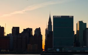 Preview wallpaper city, buildings, evening, water