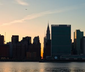 Preview wallpaper city, buildings, evening, water