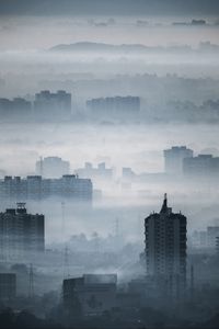 Preview wallpaper city, buildings, fog, aerial view, illusion