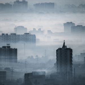 Preview wallpaper city, buildings, fog, aerial view, illusion