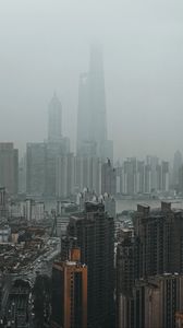 Preview wallpaper city, buildings, fog, aerial view