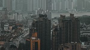 Preview wallpaper city, buildings, fog, aerial view