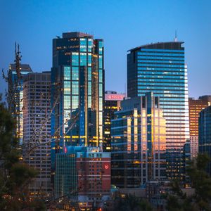 Preview wallpaper city, buildings, glass, reflection, trees