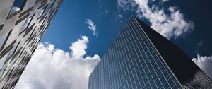 Preview wallpaper city, buildings, glass, reflection, clouds, sky