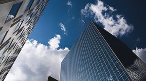 Preview wallpaper city, buildings, glass, reflection, clouds, sky
