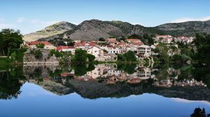 Preview wallpaper city, buildings, lake, reflection, sky