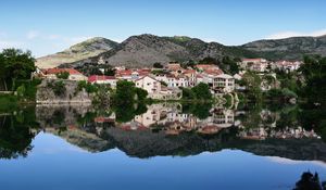 Preview wallpaper city, buildings, lake, reflection, sky