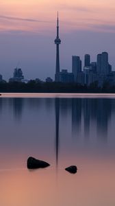 Preview wallpaper city, buildings, lake, water, reflection, dusk