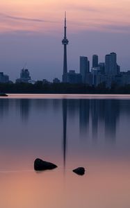 Preview wallpaper city, buildings, lake, water, reflection, dusk