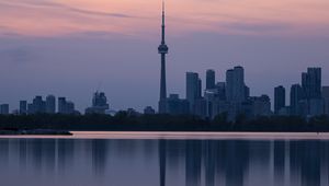 Preview wallpaper city, buildings, lake, water, reflection, dusk